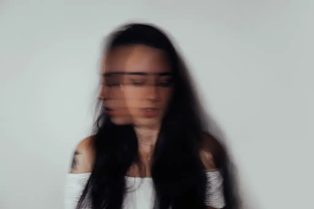 Softly blurred double portrait with visible tattoo