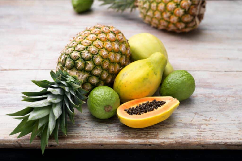 A table topped with lots of different fruits.