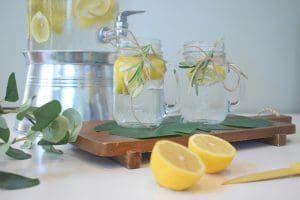 A table with lemons and two jars on it